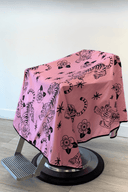 pink and black barber cape with crawling tigers and flowers